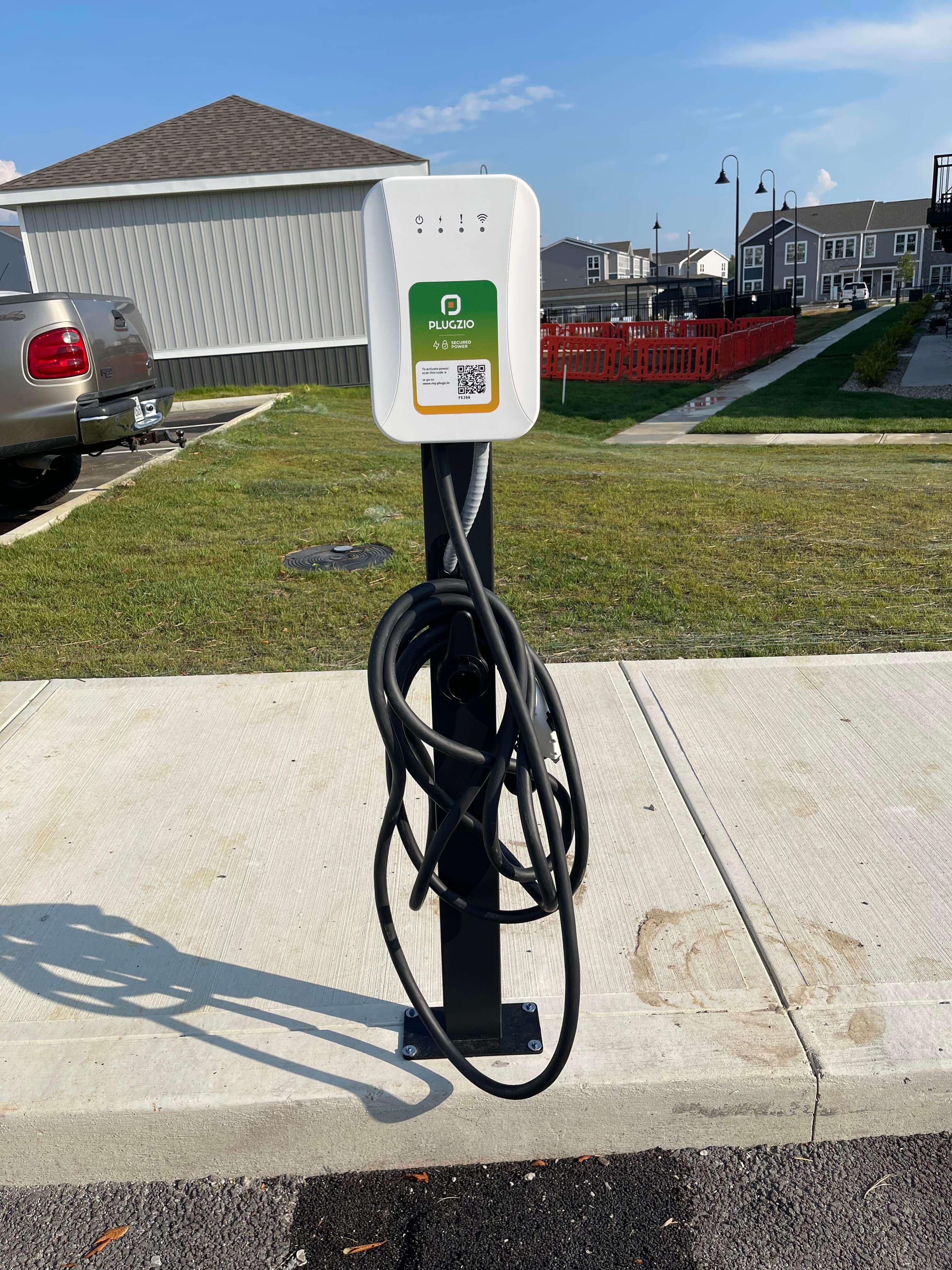 Level 2 EV charger mounted on a garage wall